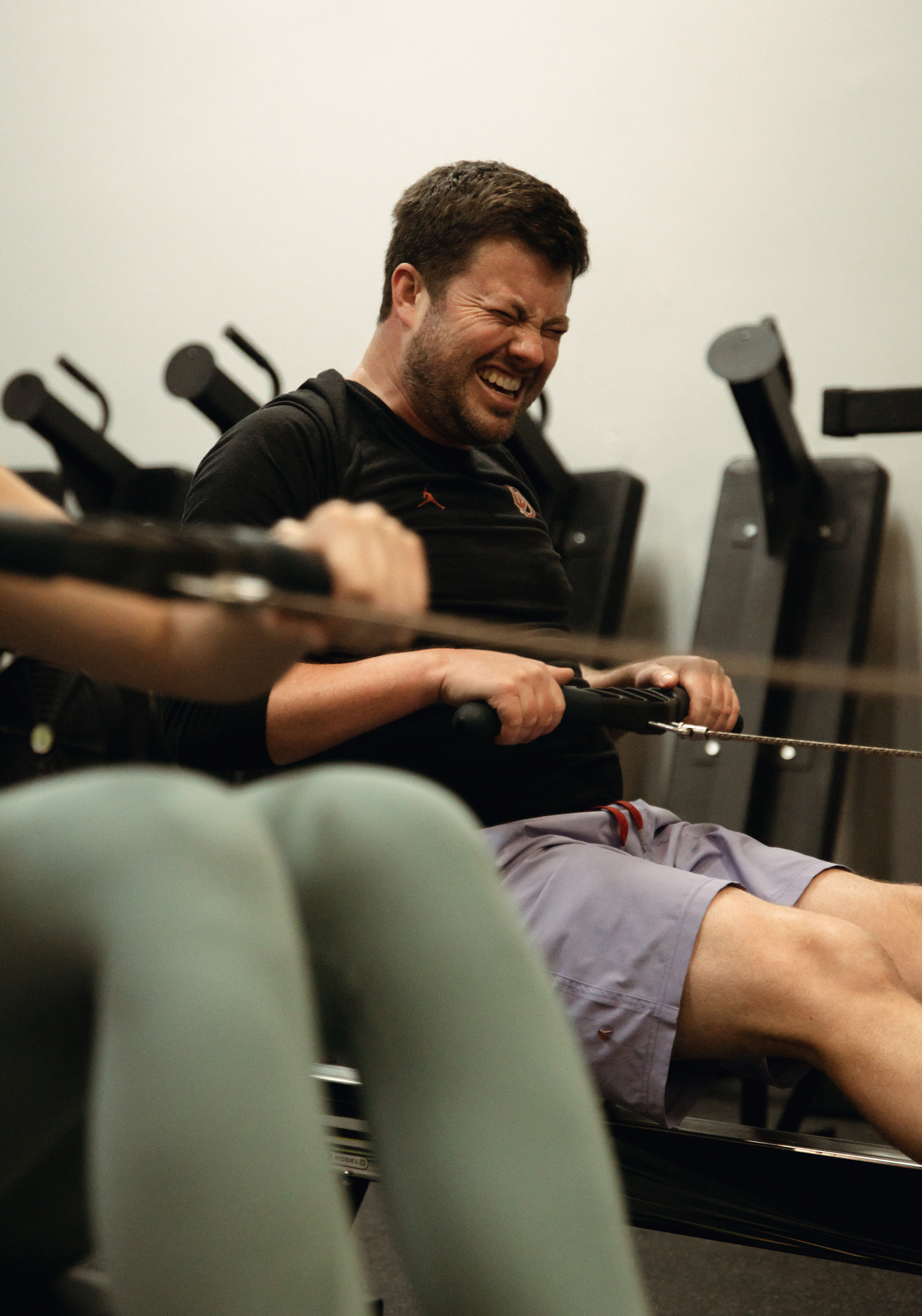 Athlete pushing hard on a rower