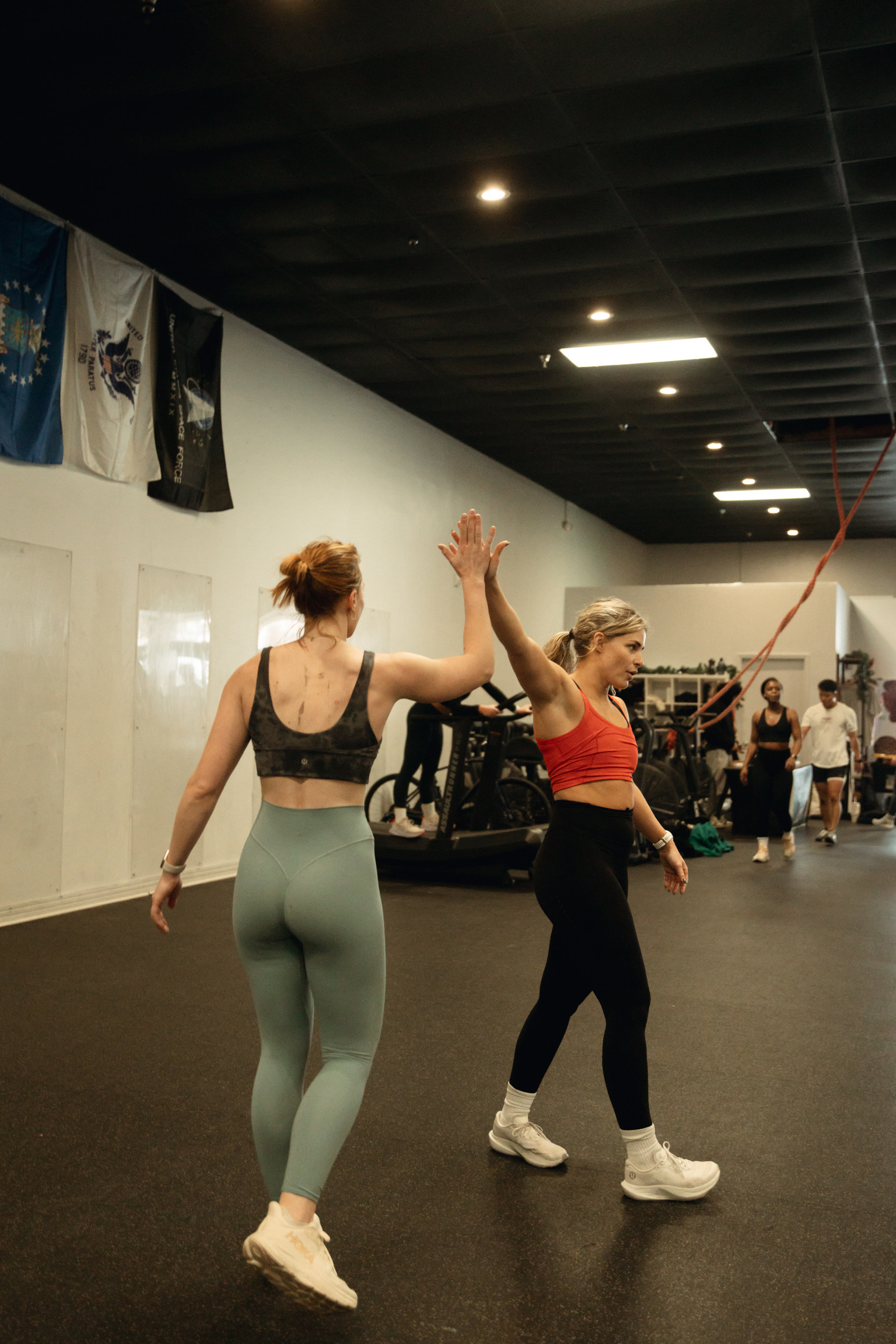 Members high-fiving after class